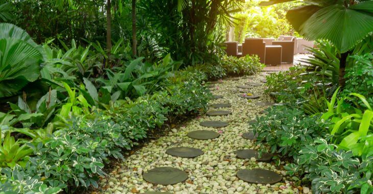 Gravel walkway leading to a patio in the garden.