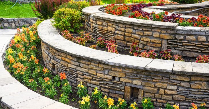 Retaining walls with flower beds.