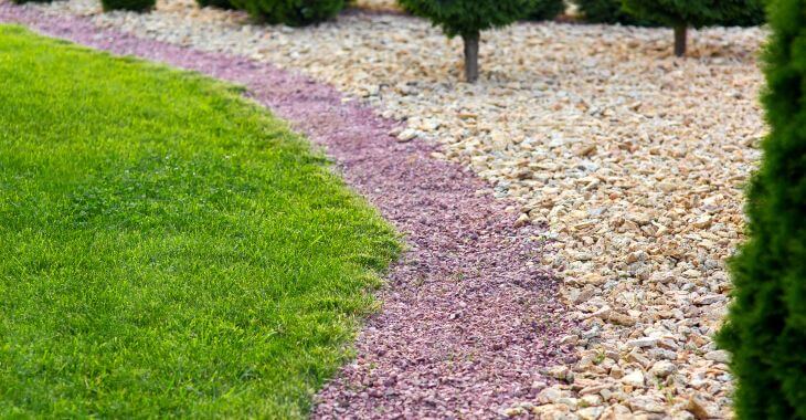 pebble pathway along a manicured lawn
