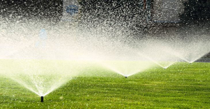 sprinkler system watering lawn